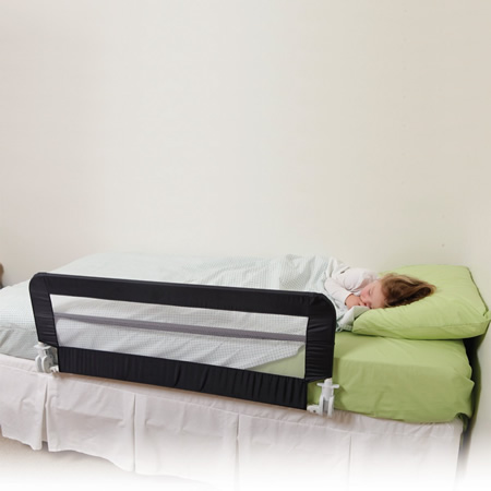 child sleeping safely with bed rail